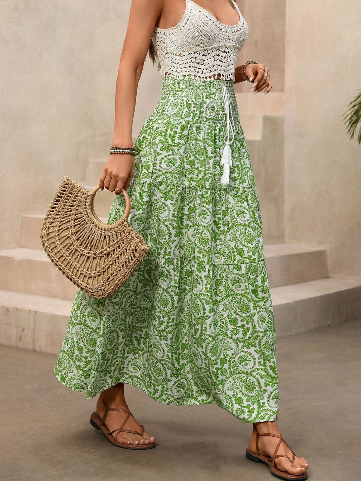 Green printed skirt styled with a simple tank top
