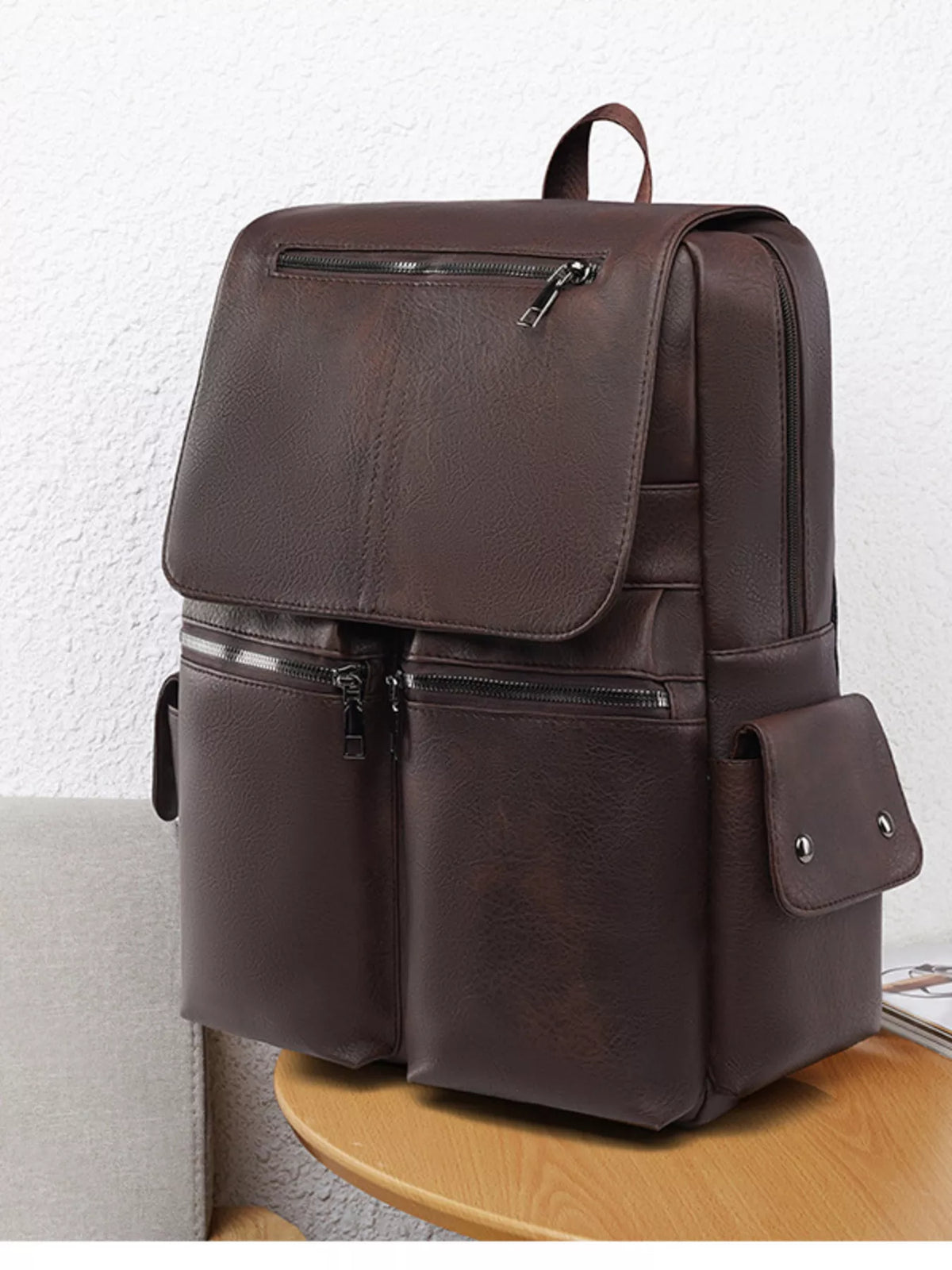 Faux leather flapover backpack side profile