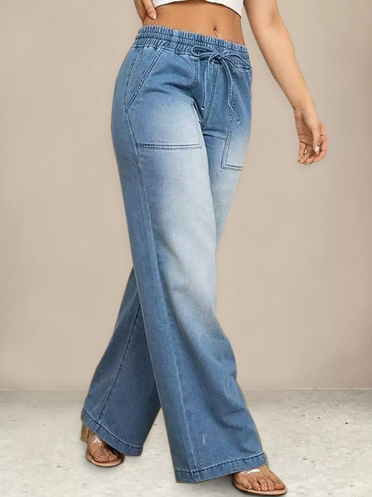 Model wearing drawstring wide leg jeans