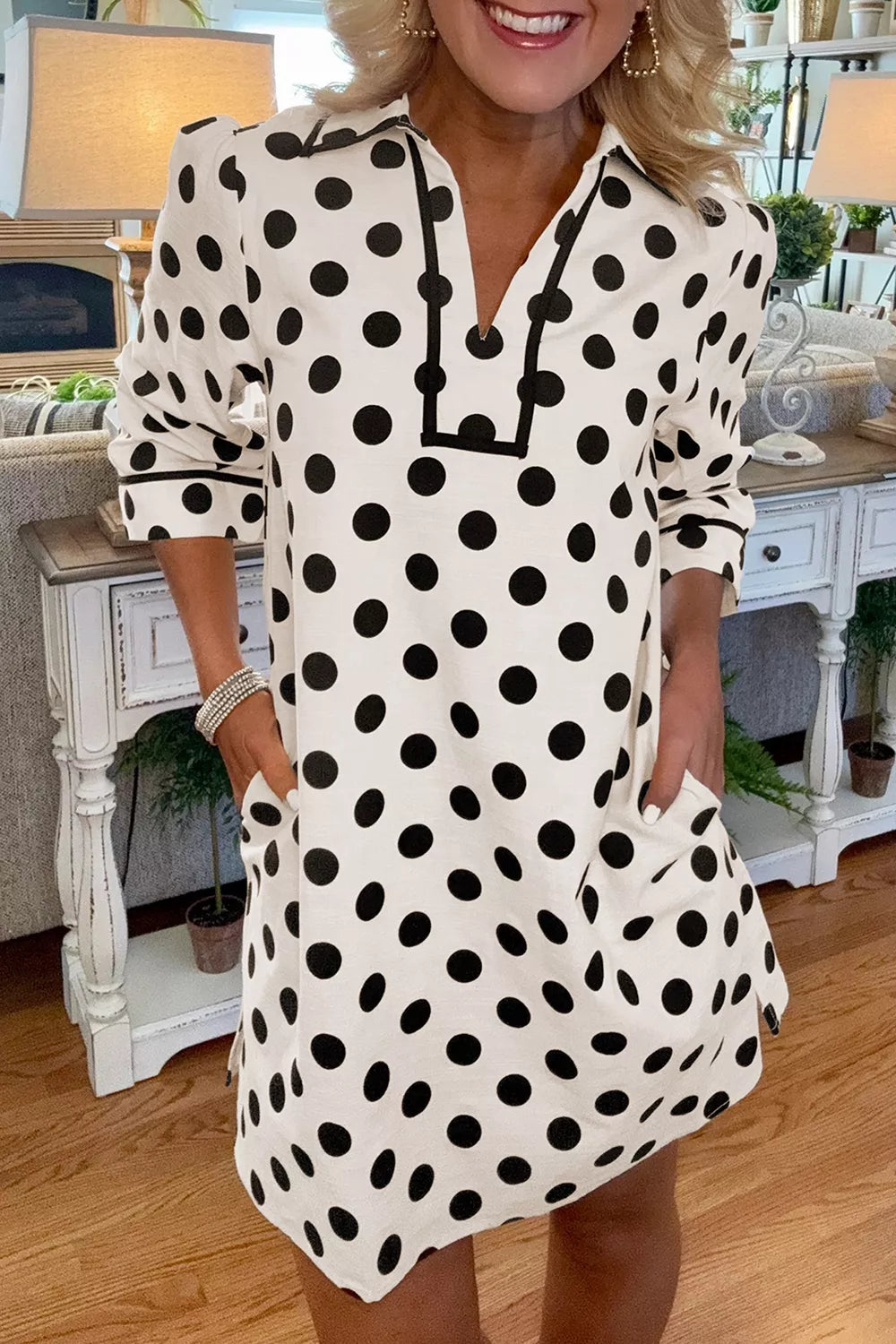 White polka dot collared v neck mini dress front view