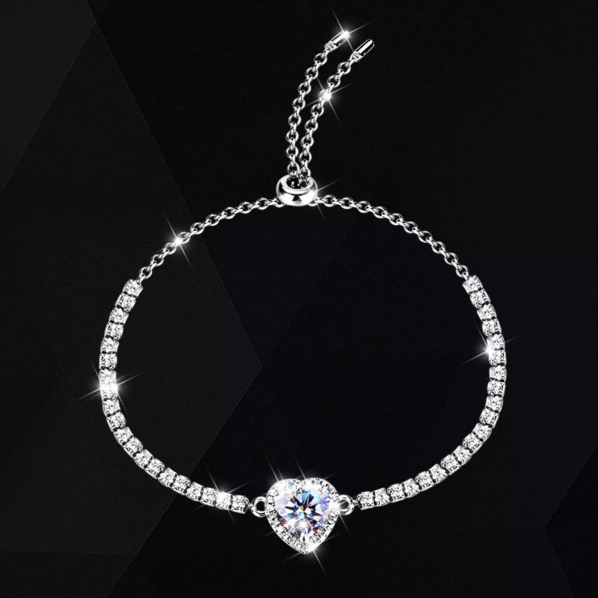 Moissanite heart chain bracelet in sterling silver on a wrist