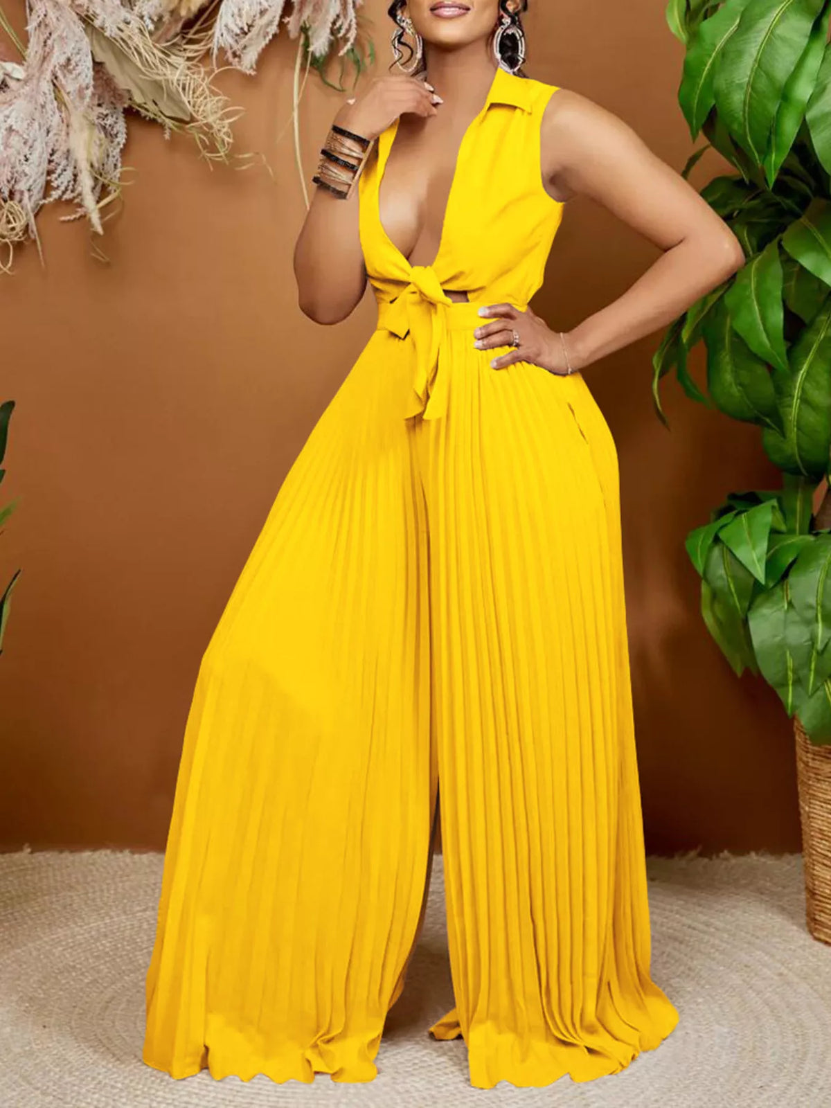 Wide leg jumpsuit side view showing pleated legs