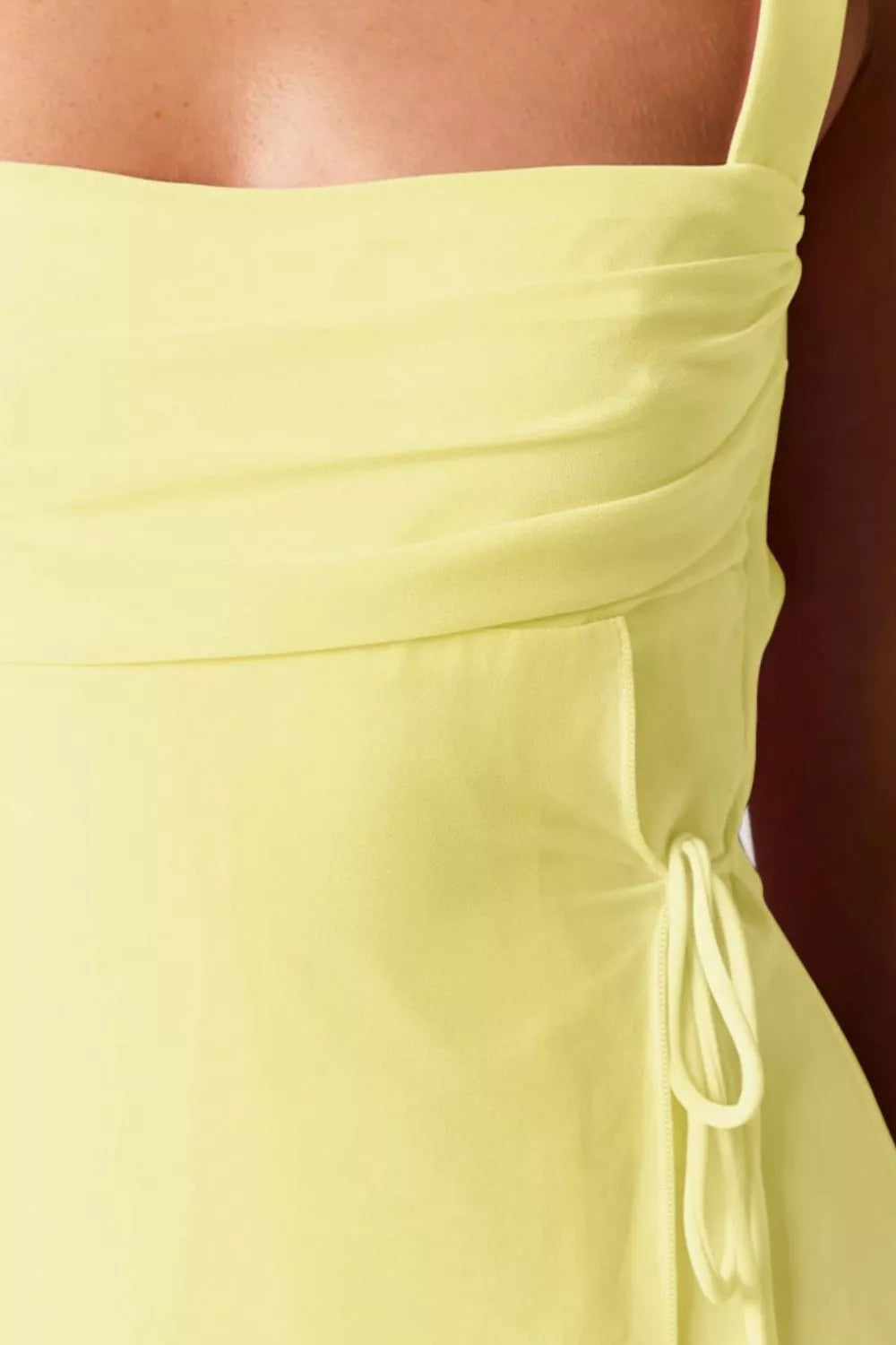 Pastel yellow sleeveless mini dress fabric detail