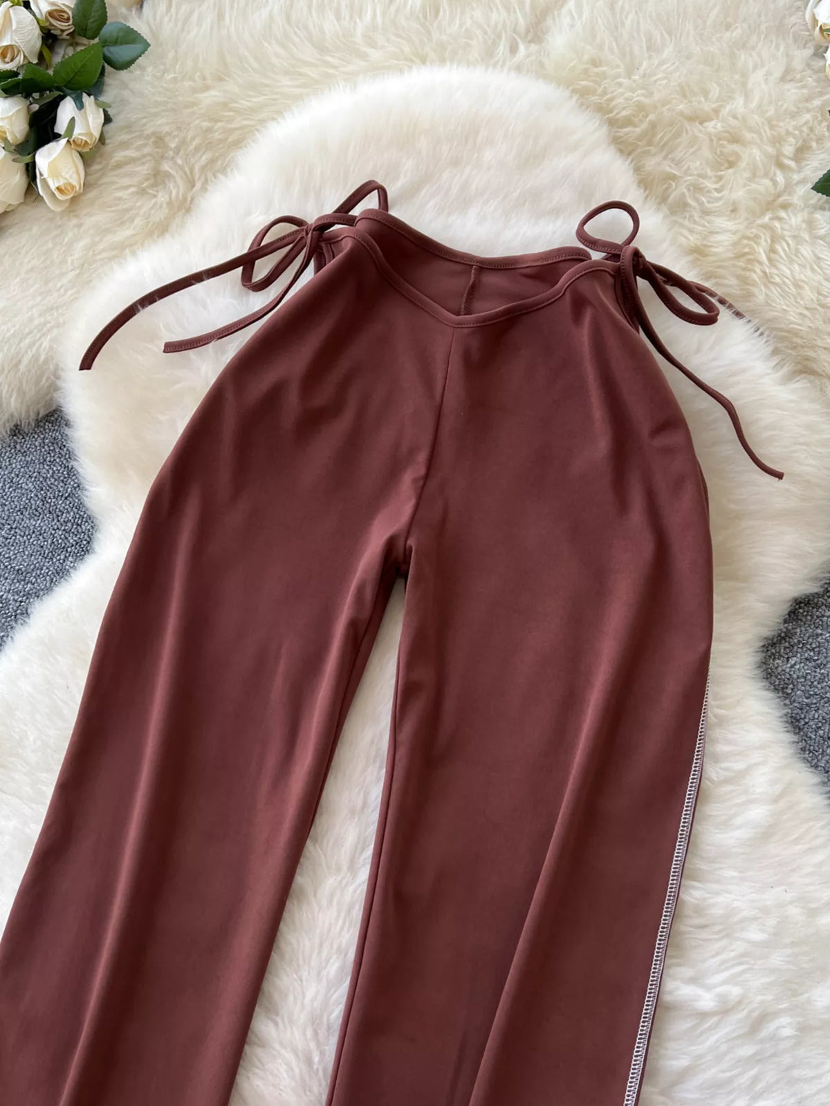 Dark brown wide leg tie waist pants, styled on model