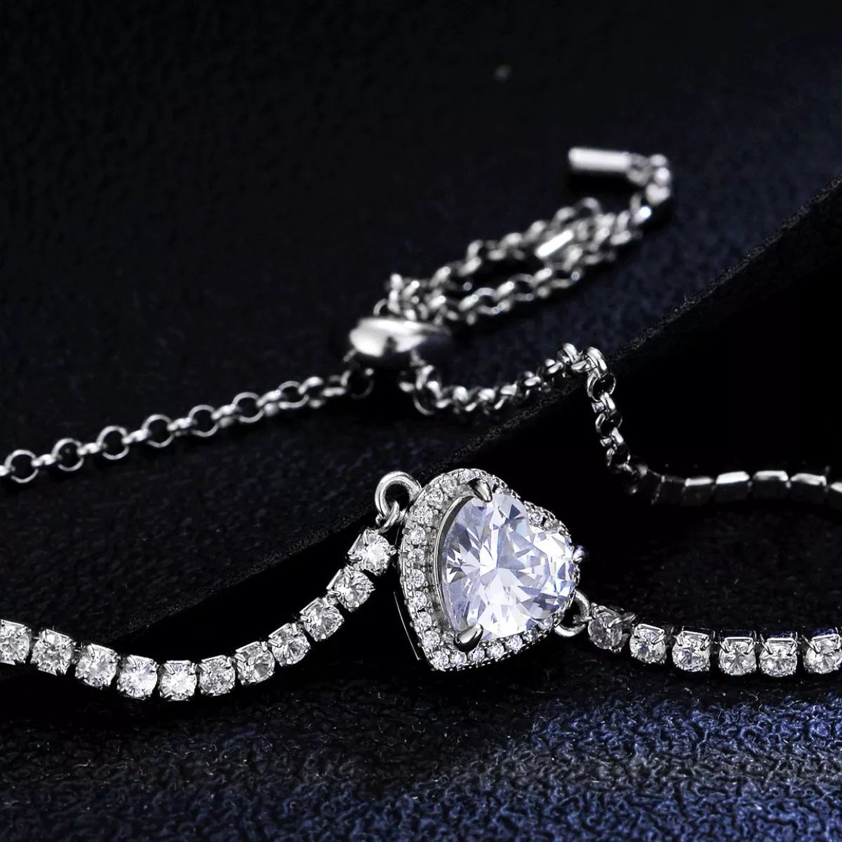 Close up of the moissanite heart pendant on the bracelet