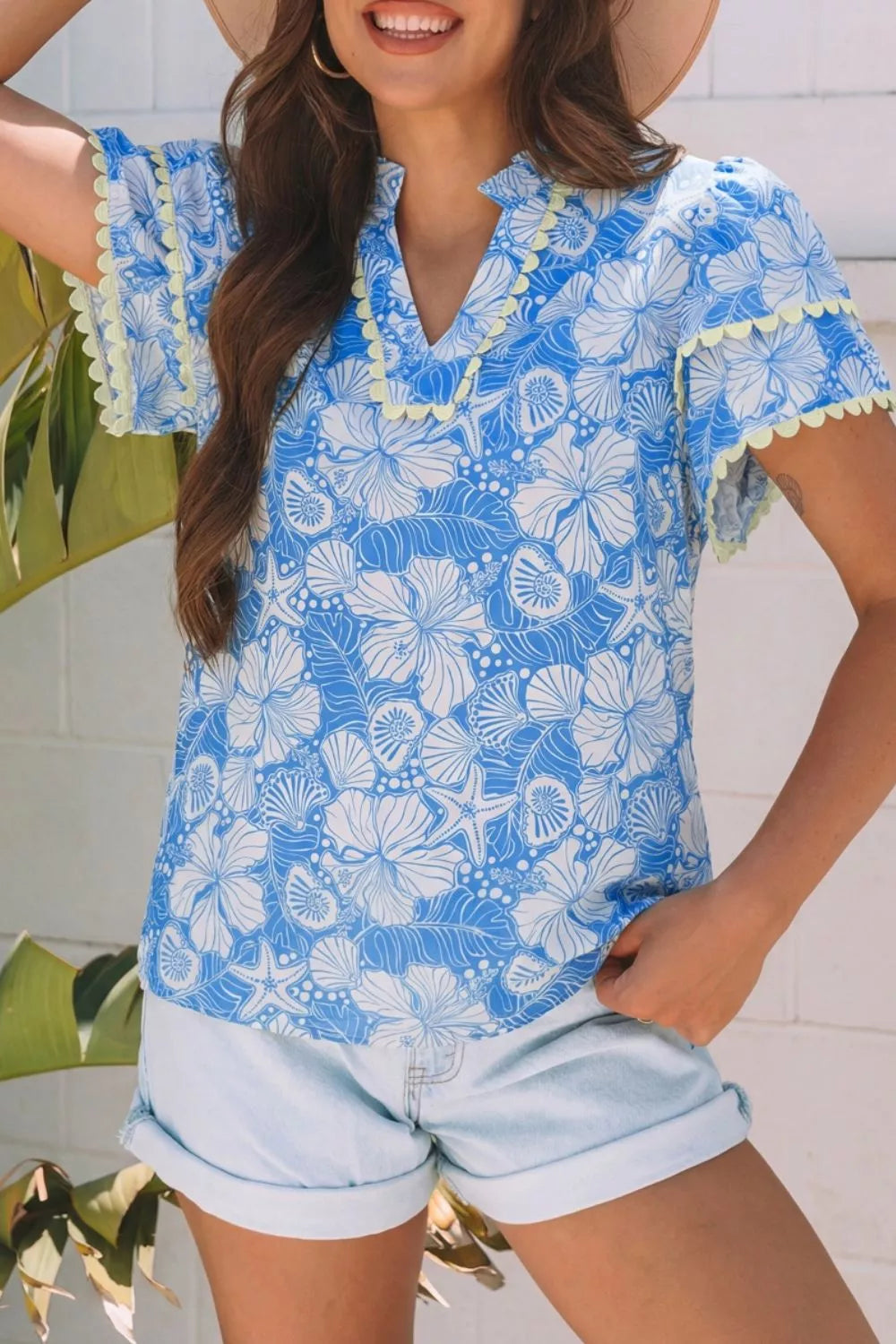 Light blue floral scalloped trim v neck blouse front view