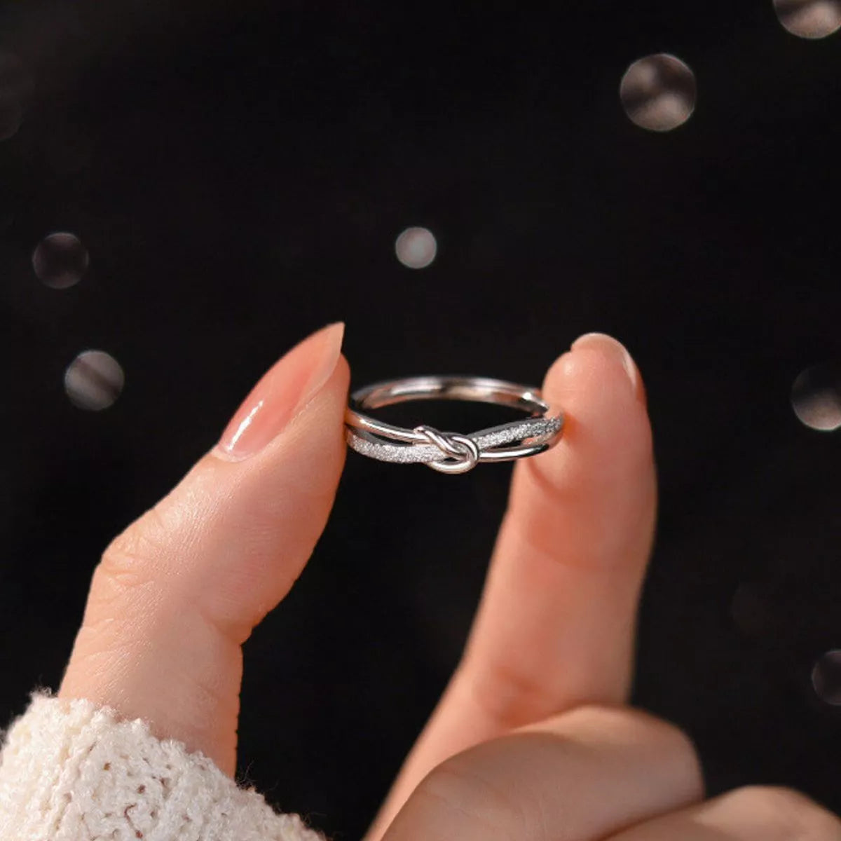 Sterling silver zircon knot ring styled view