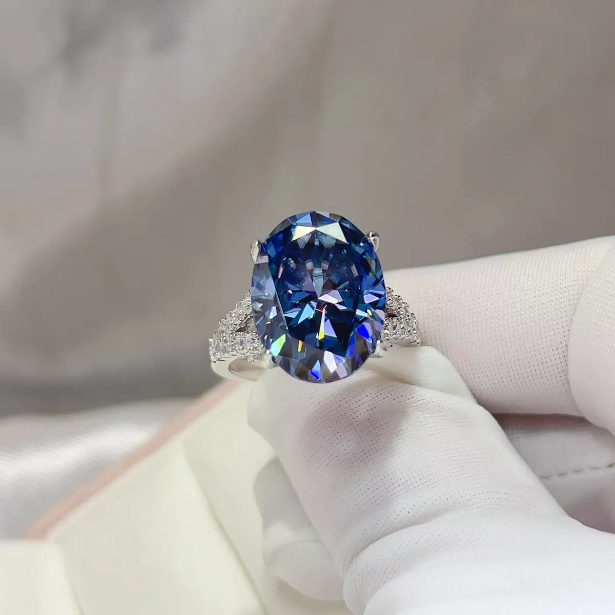 Sterling silver band detail on blue moissanite ring