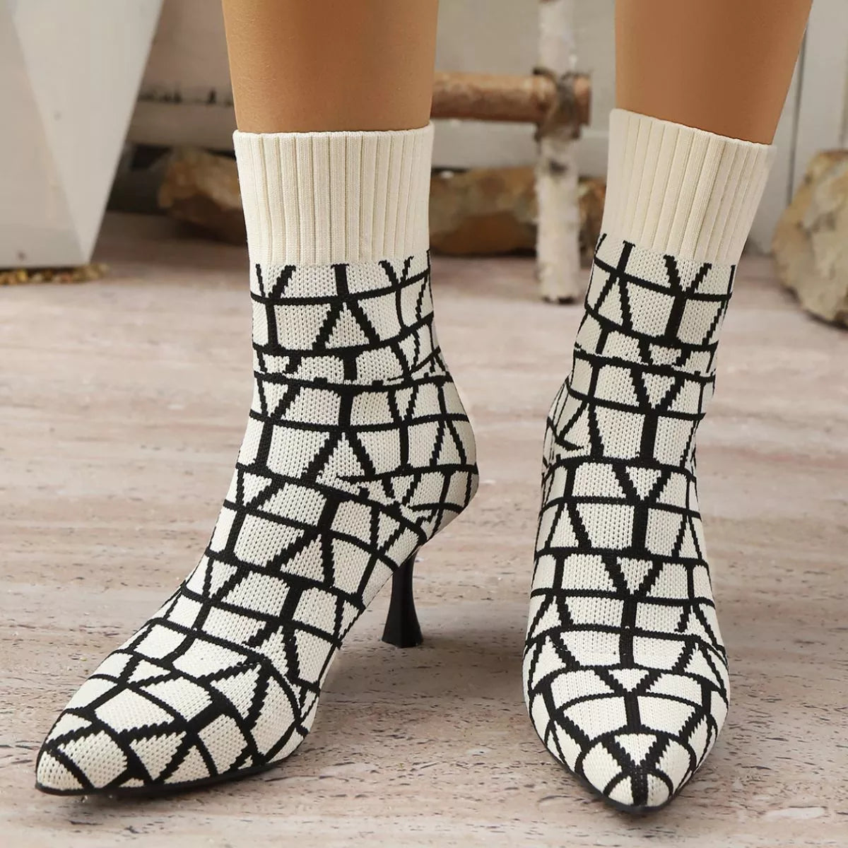 Red point toe flared heel boots pair standing together