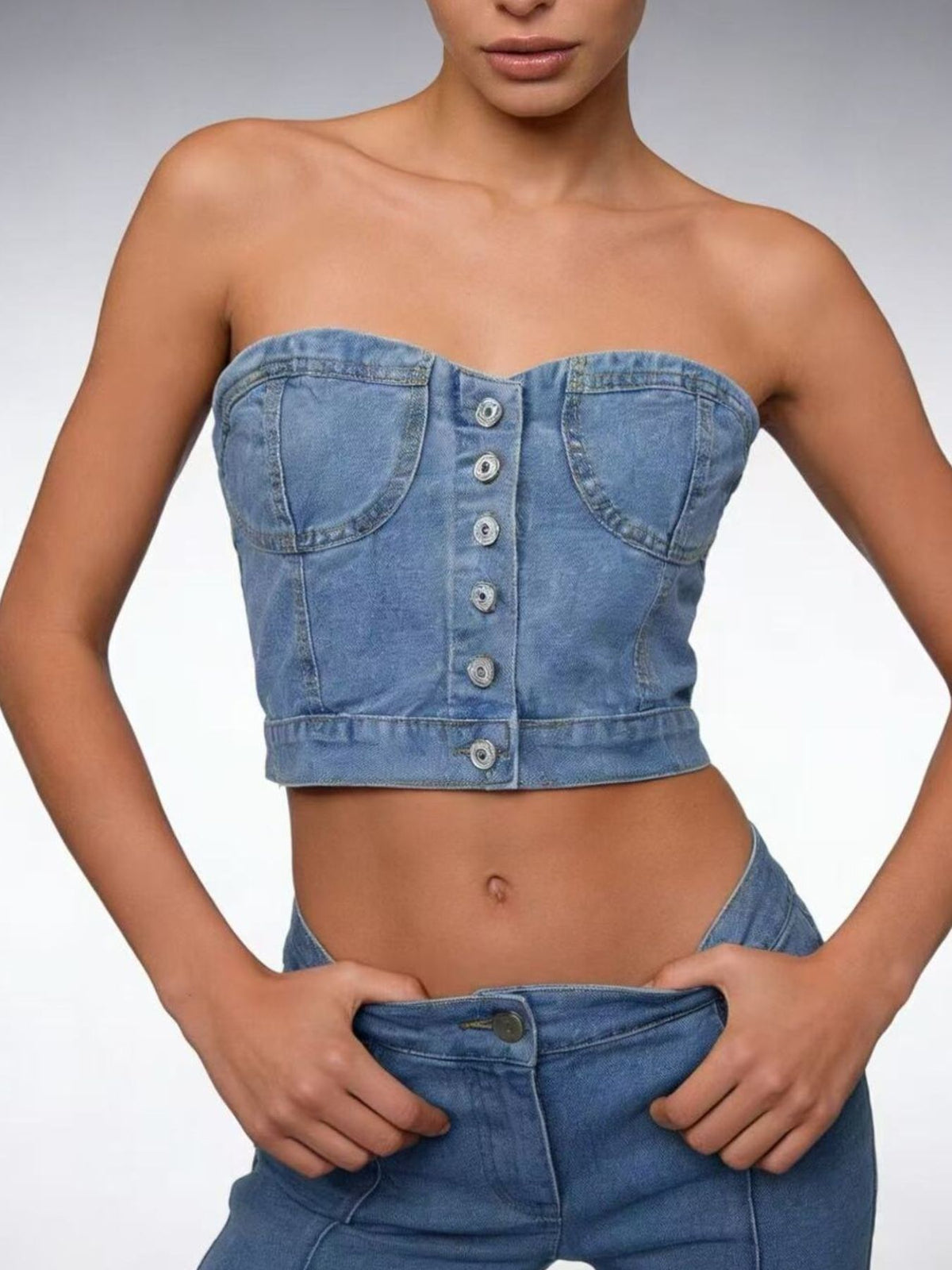 Detail of the light blue denim fabric and topstitching