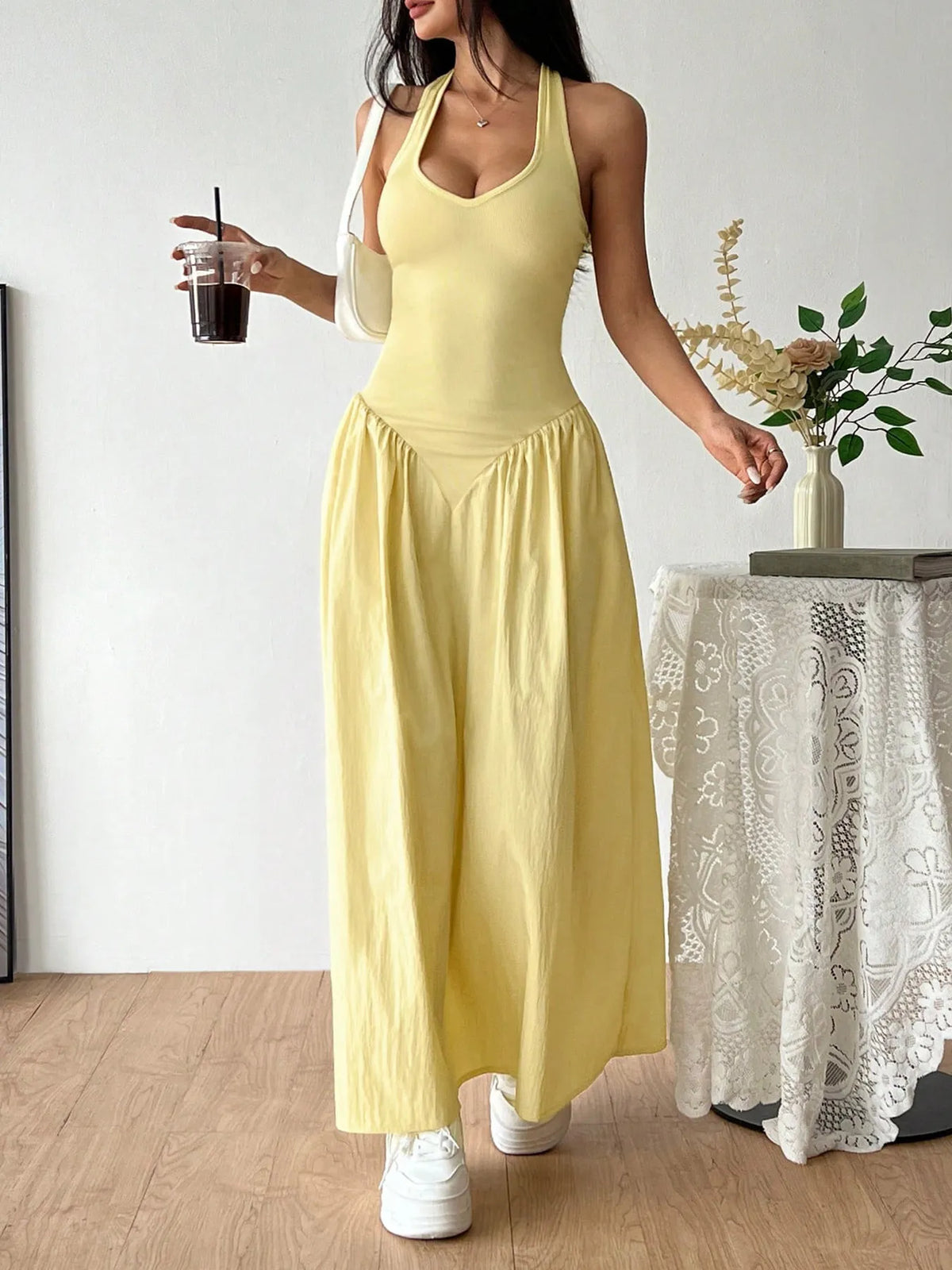 Light yellow halter neck maxi dress, side view