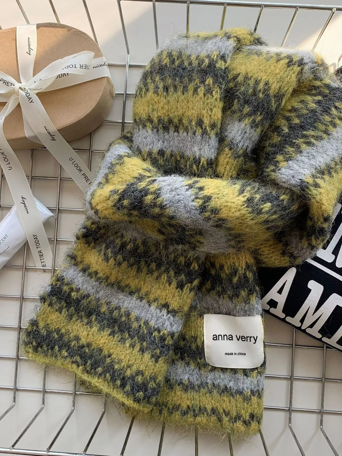 Wool knit scarf styled over an overcoat
