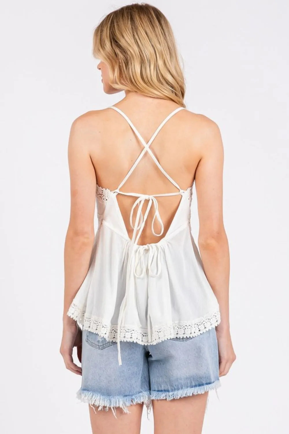 Close up of lace detail on ivory cami top