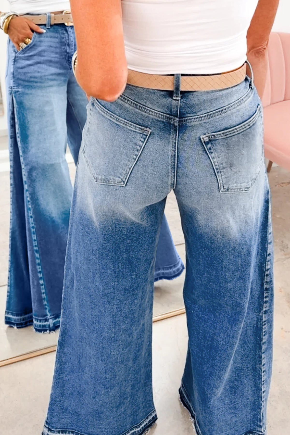 Side view of blue flare leg denim jeans showing full length fit