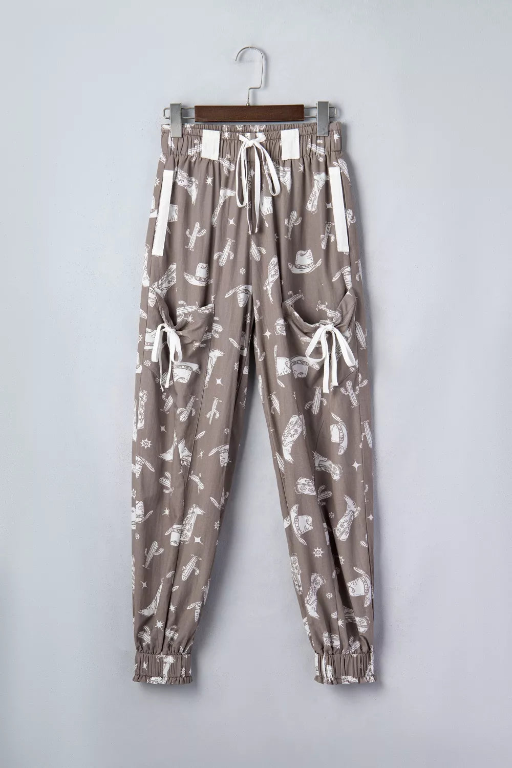 Mocha western cactus print drawstring jogger pants, styled on model