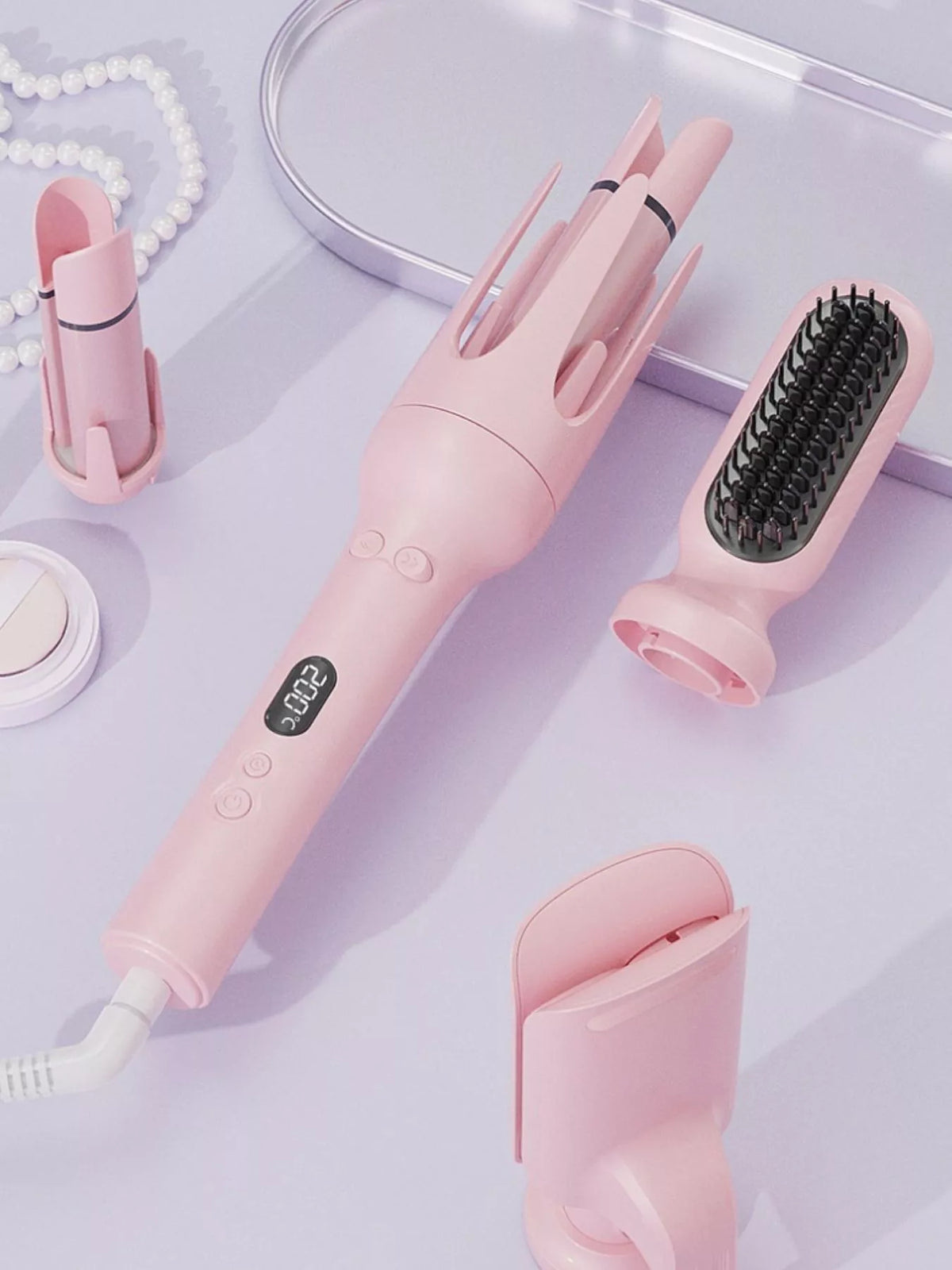 Curling iron with rotating barrel