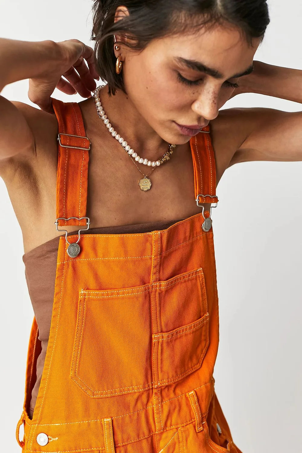Orange overalls wide crisscross strap detail