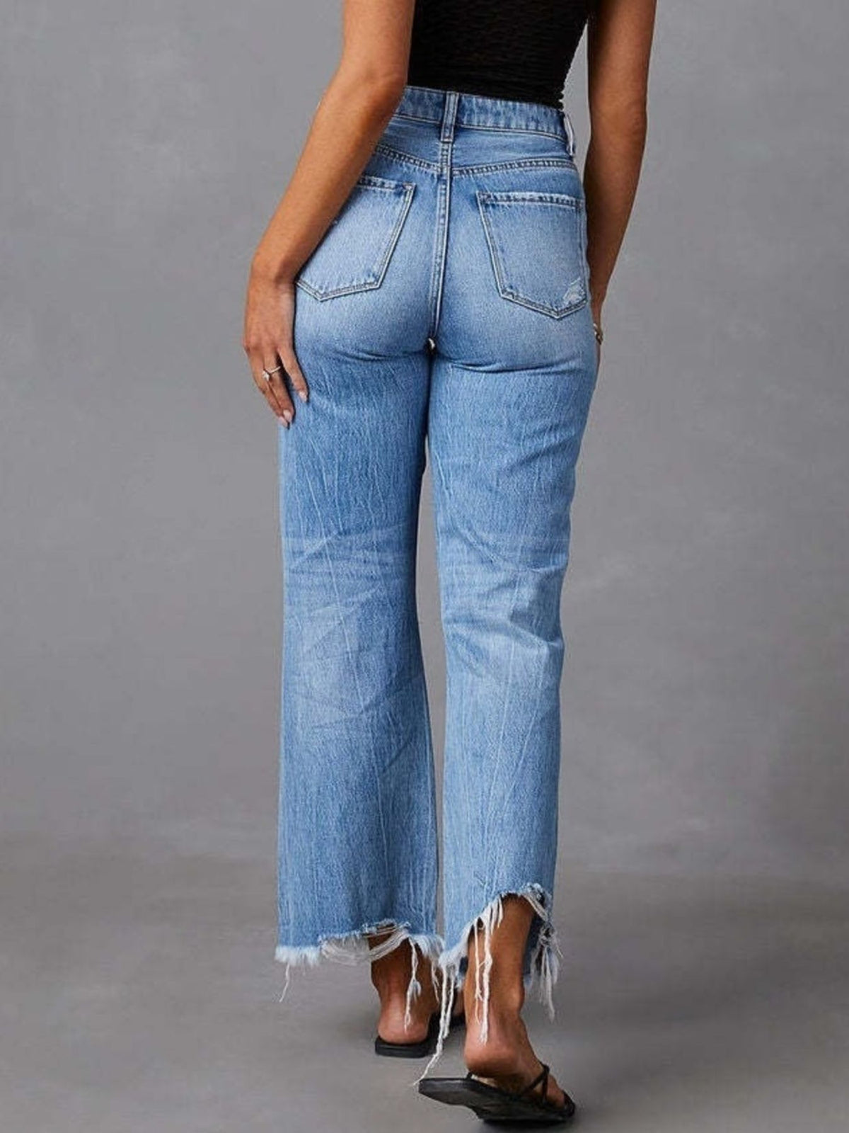 Back view of distressed flare jeans