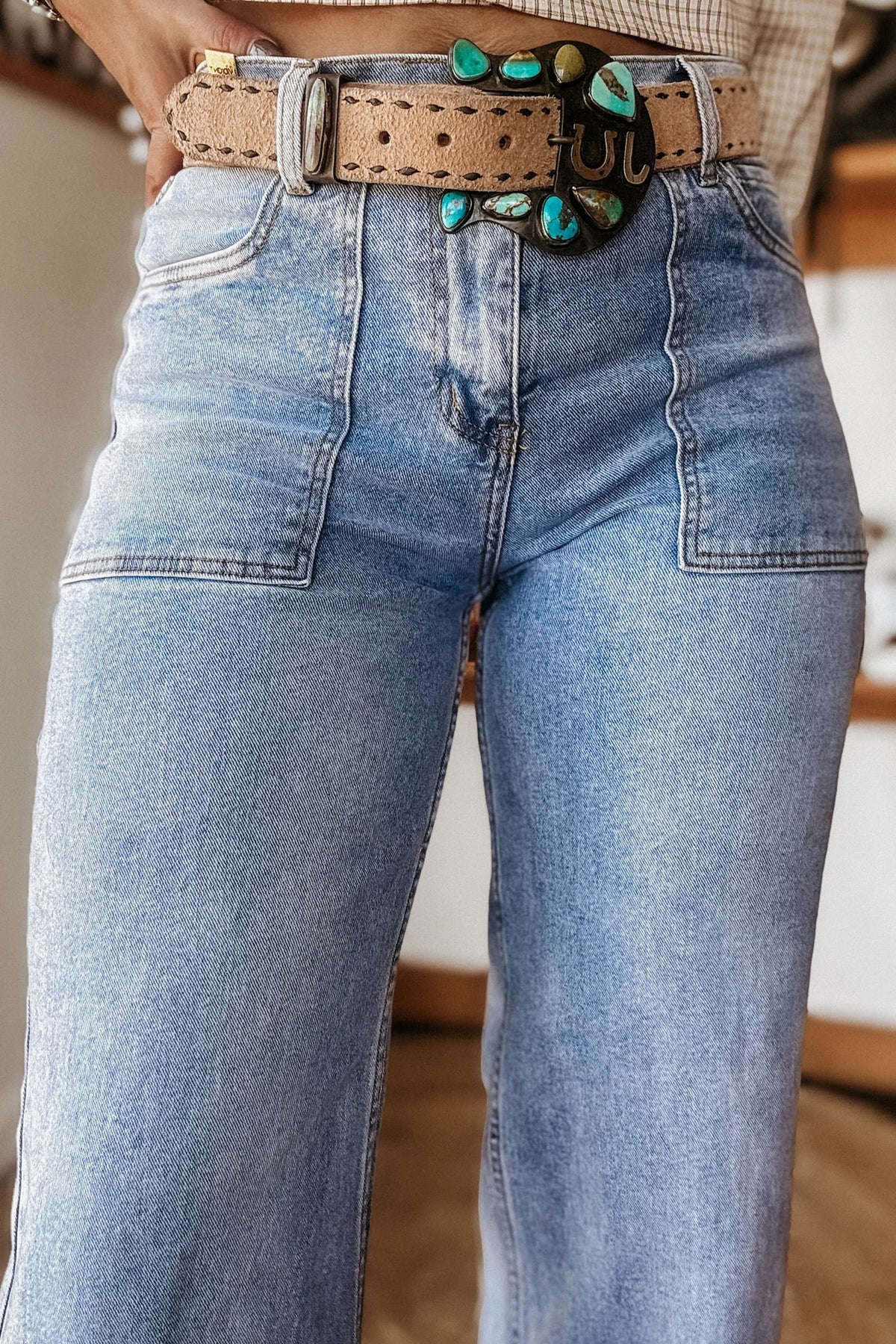 Side view of relaxed fit blue denim jeans