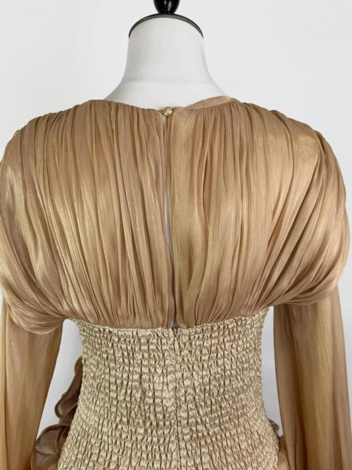 Ruffled long sleeve dress three quarter view
