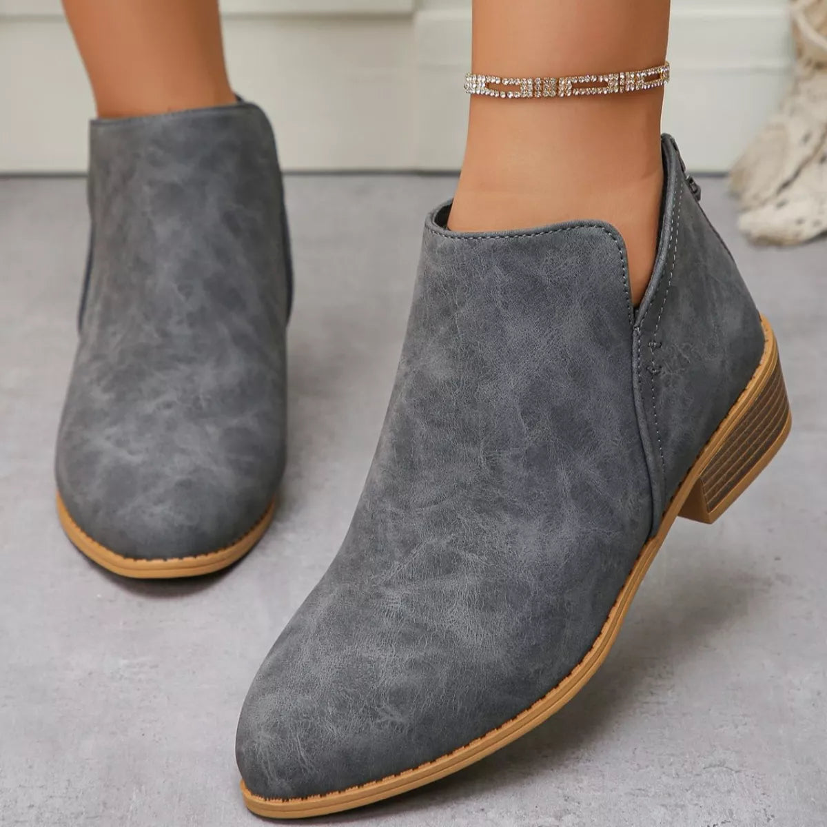 Point toe block heel ankle boots angled view
