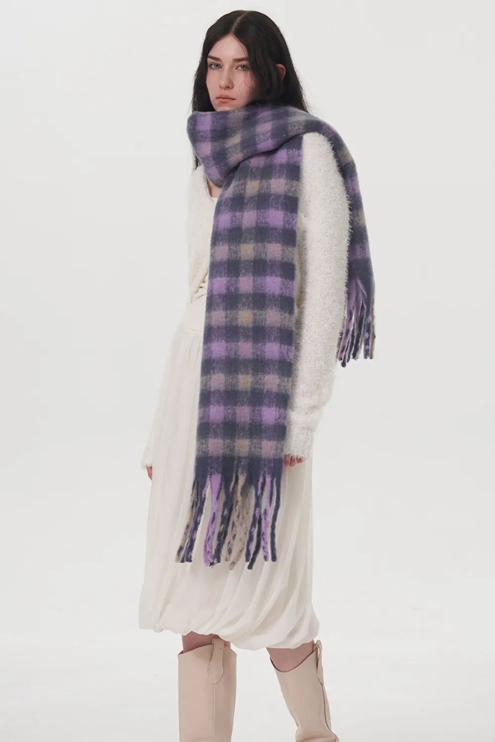 Close view of the plaid pattern on the fringe scarf