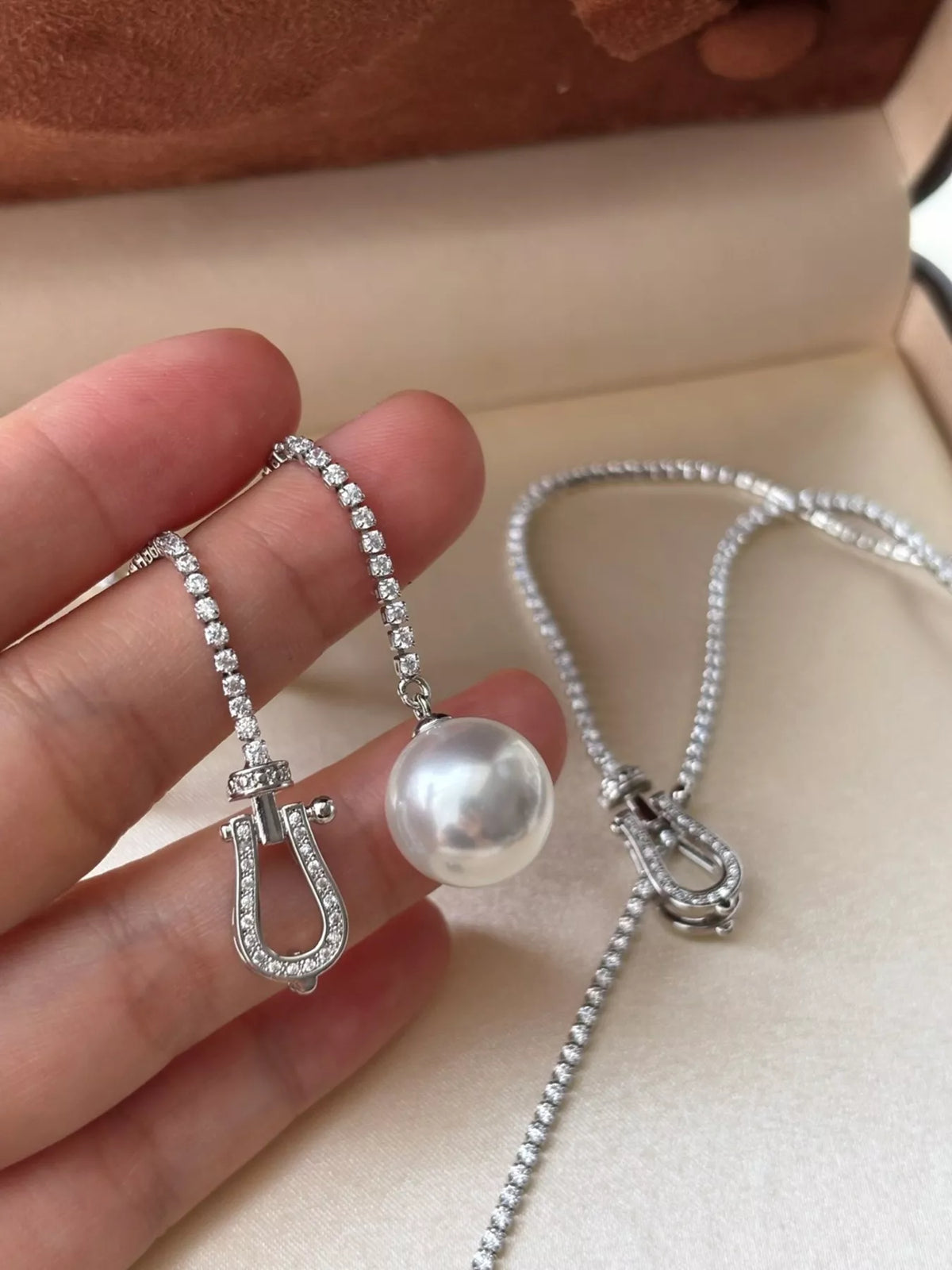 Pearl drop Y necklace with zircon accents, styled outfit