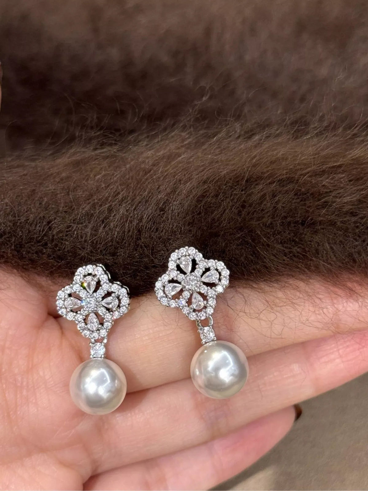 Silver pearl drop earrings pair view
