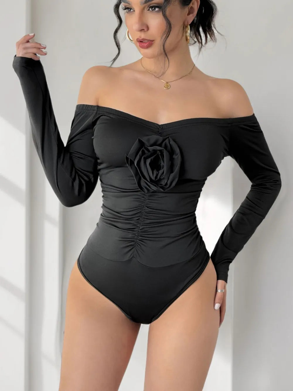 Perfee Ruched Flower Off-Shoulder Long Sleeve Bodysuit - Fashorio