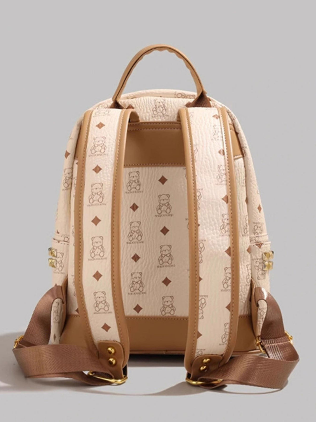 Cream bear mini backpack worn on the back