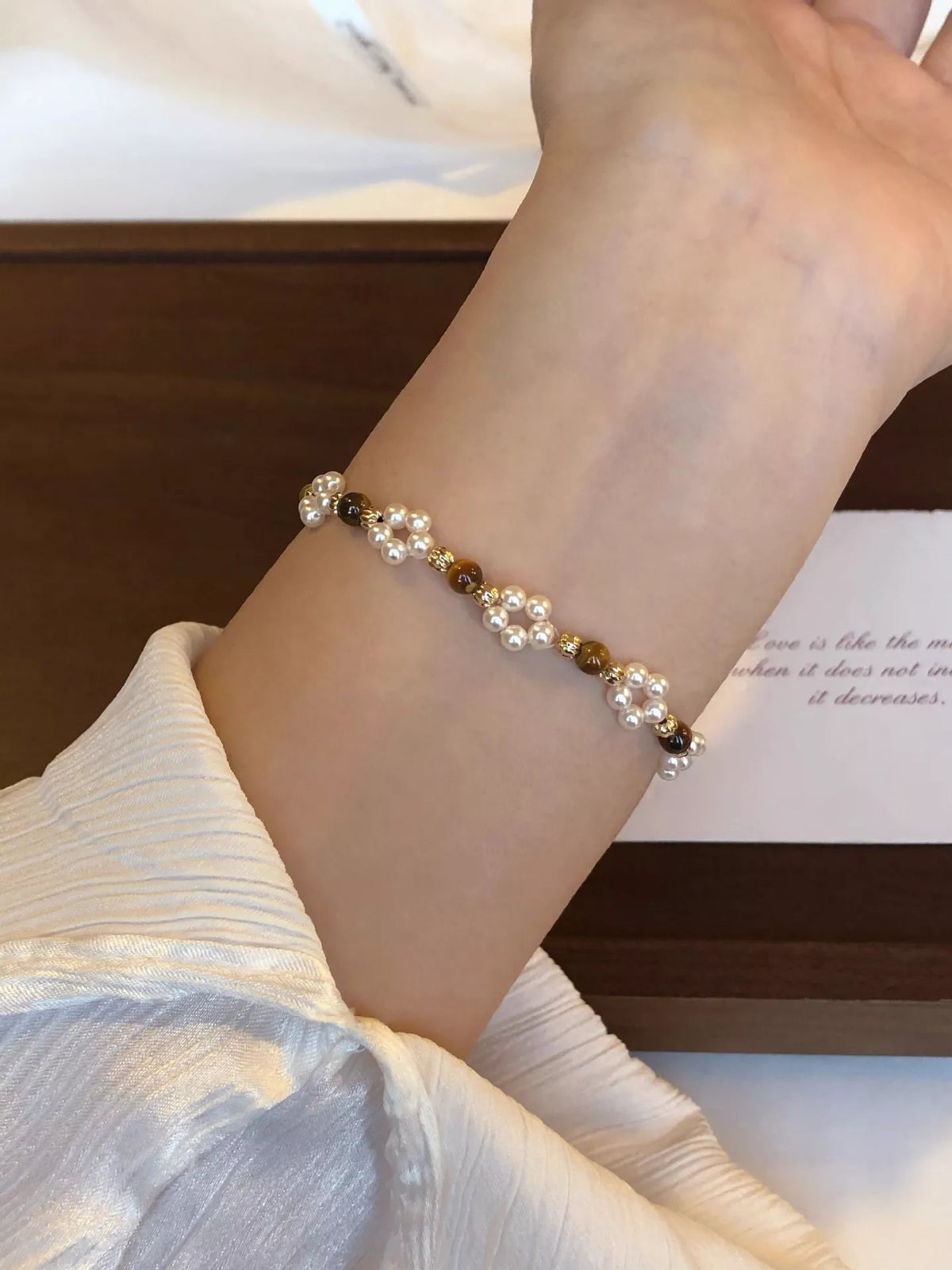 Pearl and tiger eye beaded bracelet on wrist