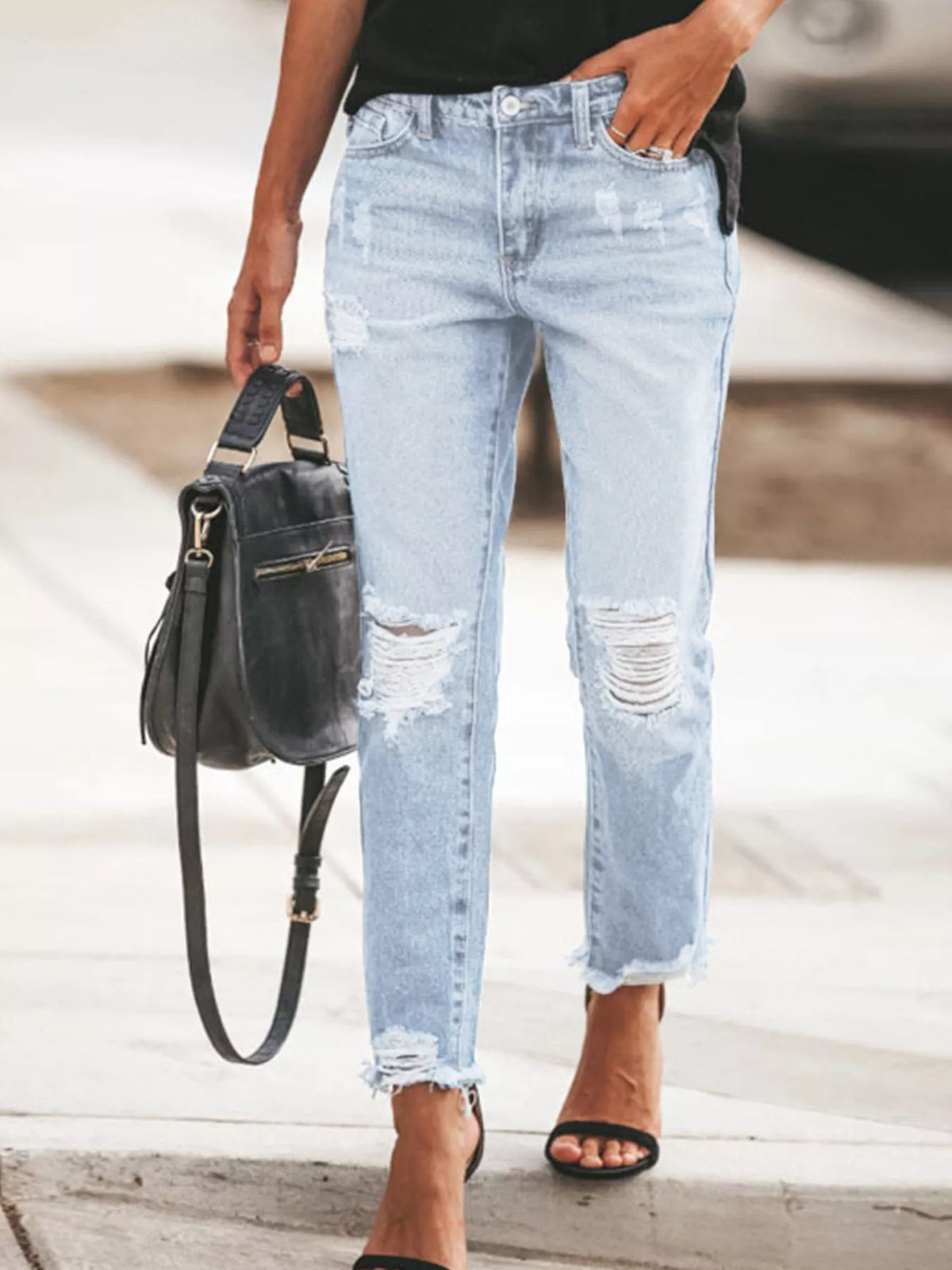 Distressed ankle jeans front view