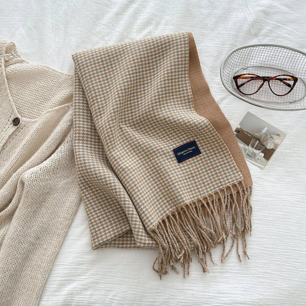 Plaid scarf shown in a soft neutral combination