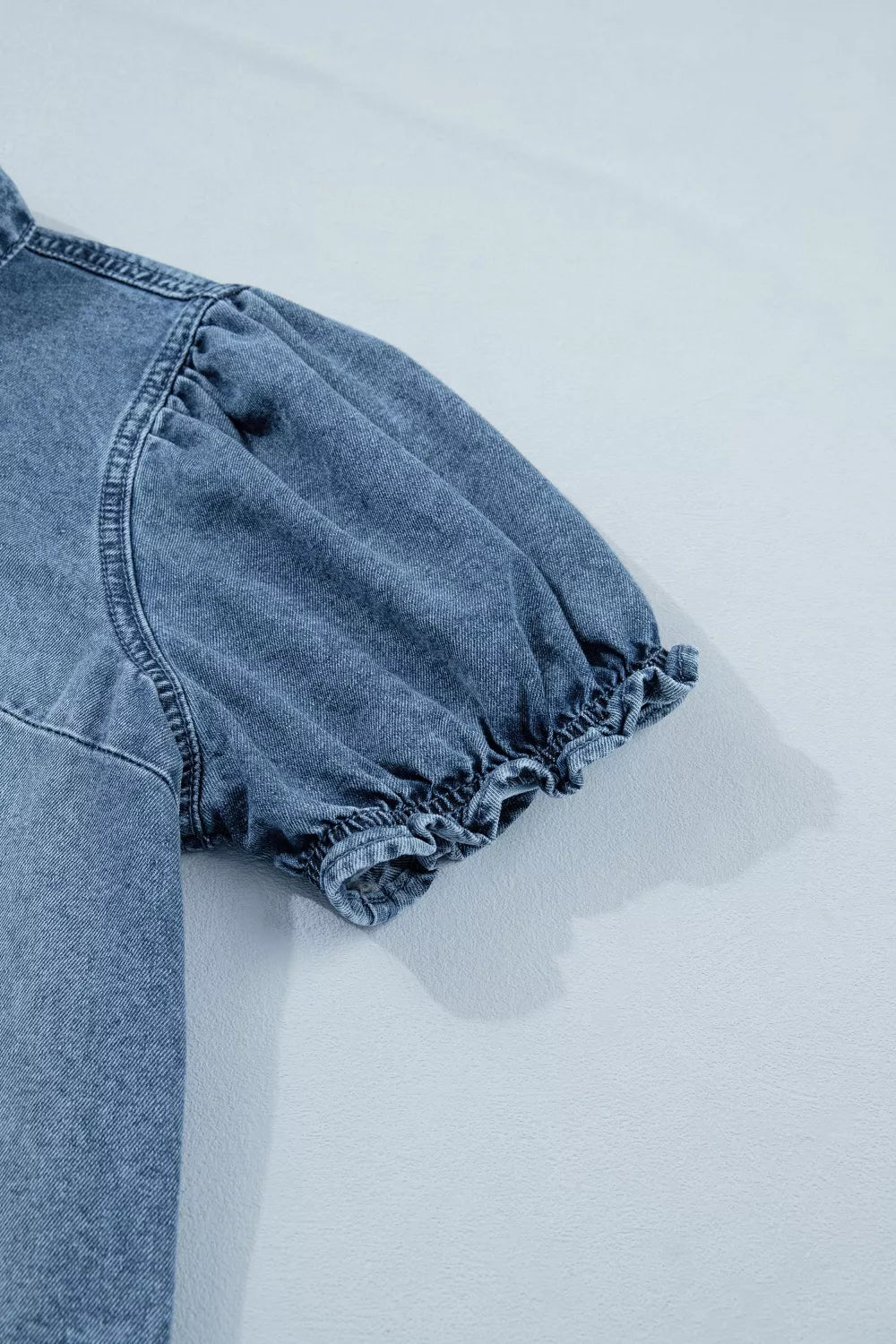 Medium wash frilled snap button denim shirt side view