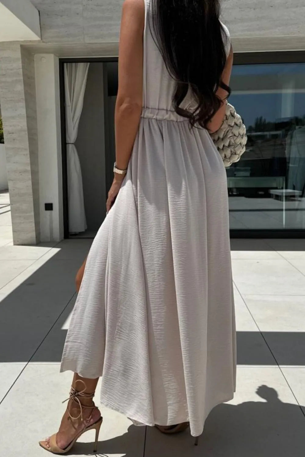 sleeveless surplice wrap maxi dress with leg slit fabric and print detail