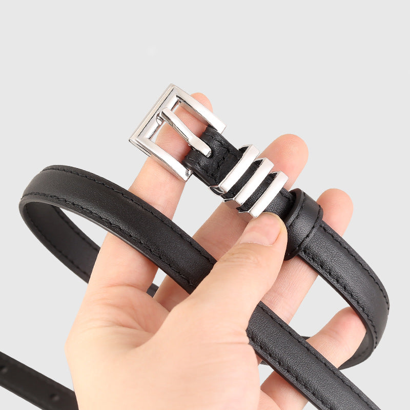 Skinny leather belt with silver buckle front view