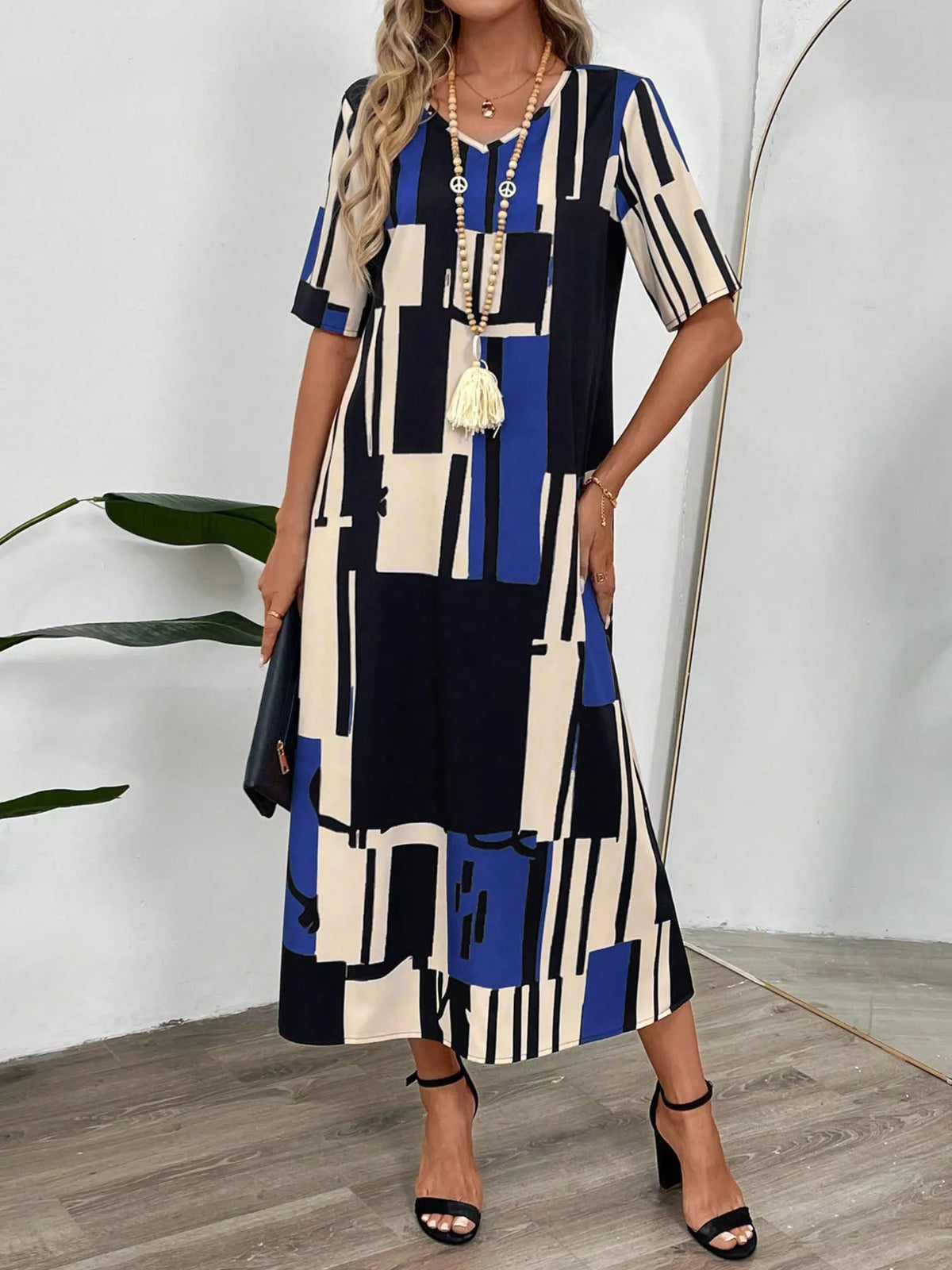 Abstract geometric print v neck midi dress styled view