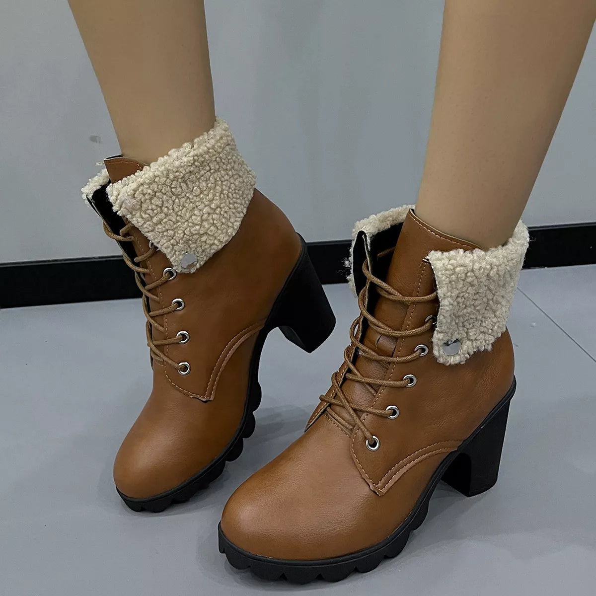 Lace up block heel boots upper detail