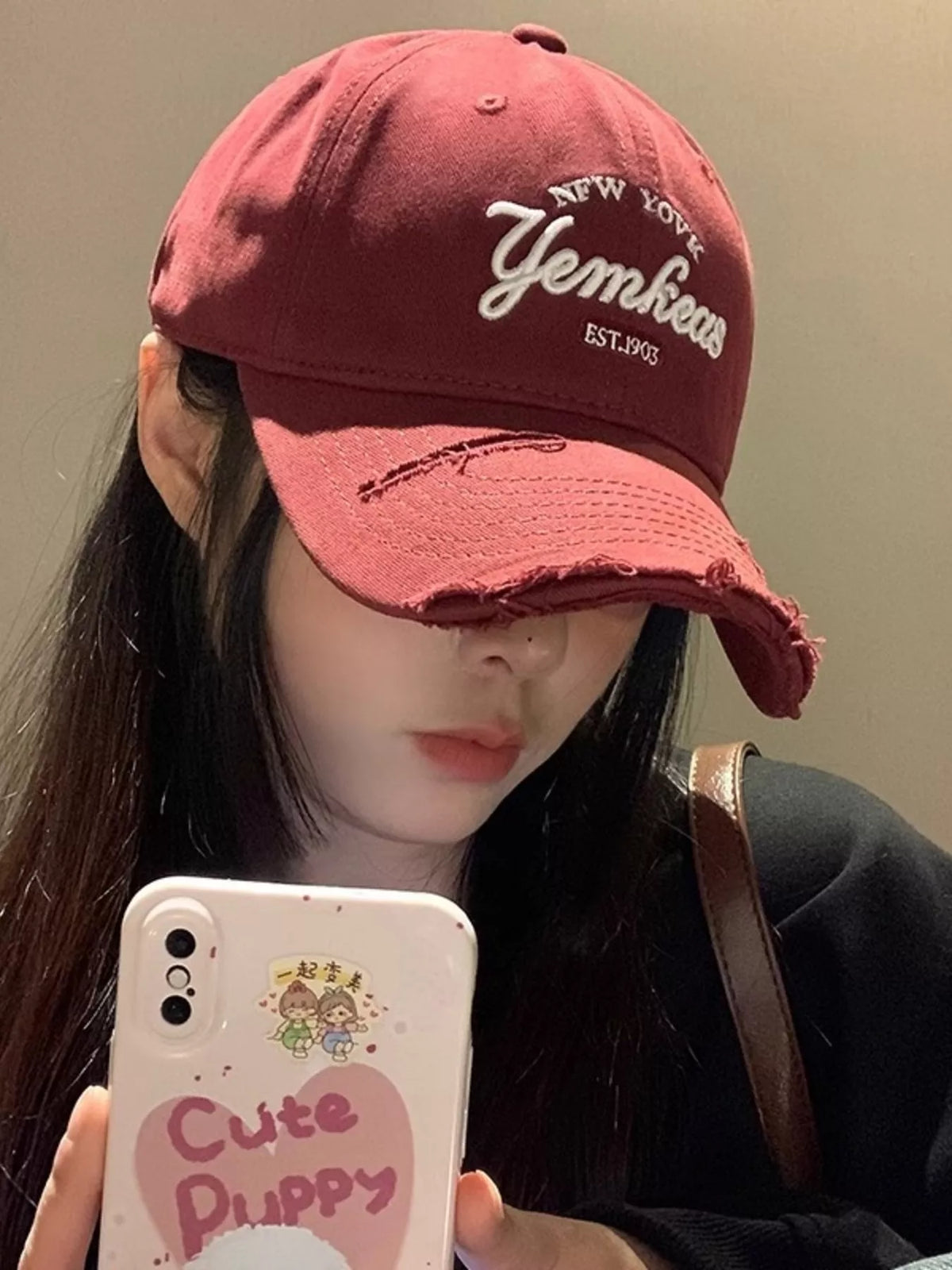 Front view of the wine red distressed baseball cap