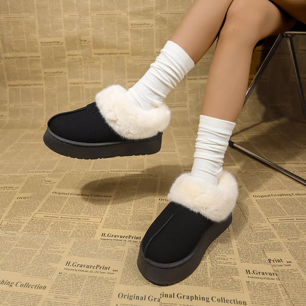 Fuzzy trim platform boots against a plain backdrop