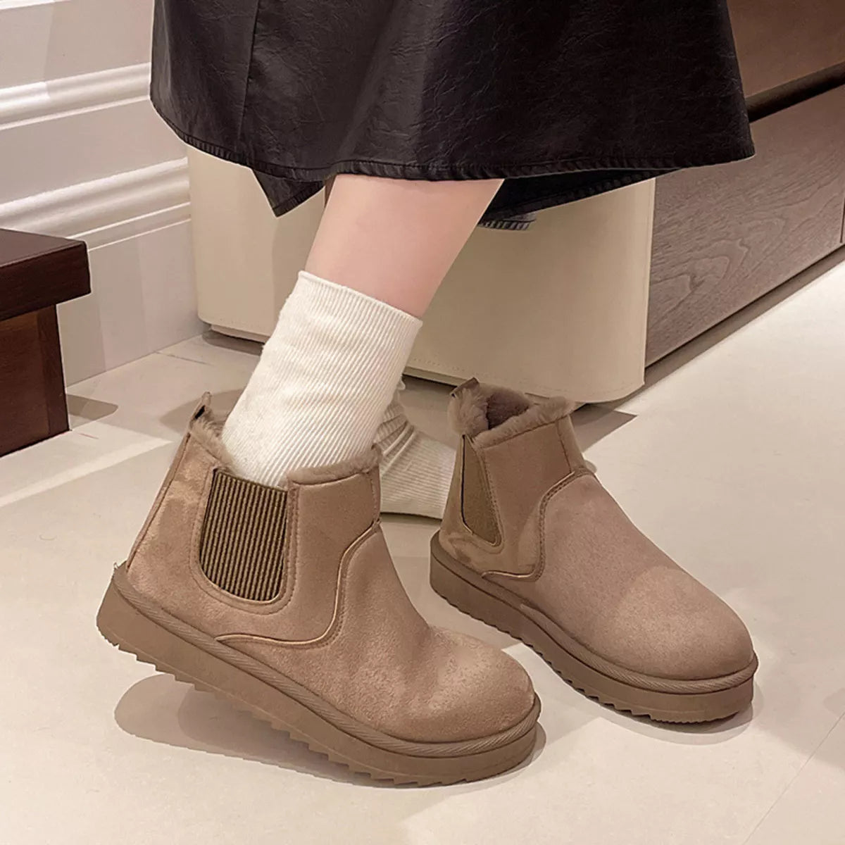 Round toe platform boots detail of the upper
