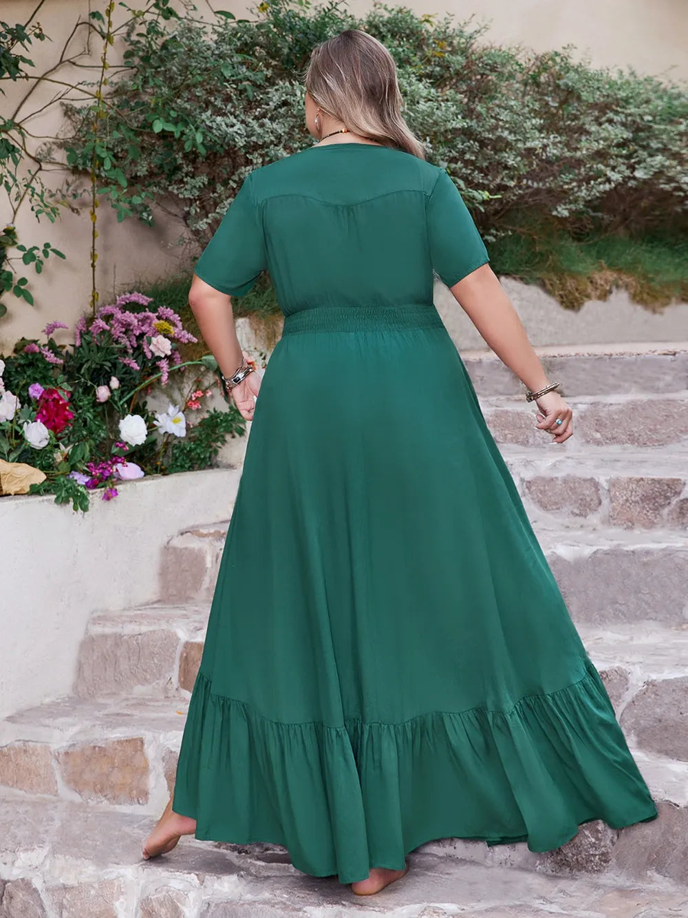 Side slit on deep teal maxi dress