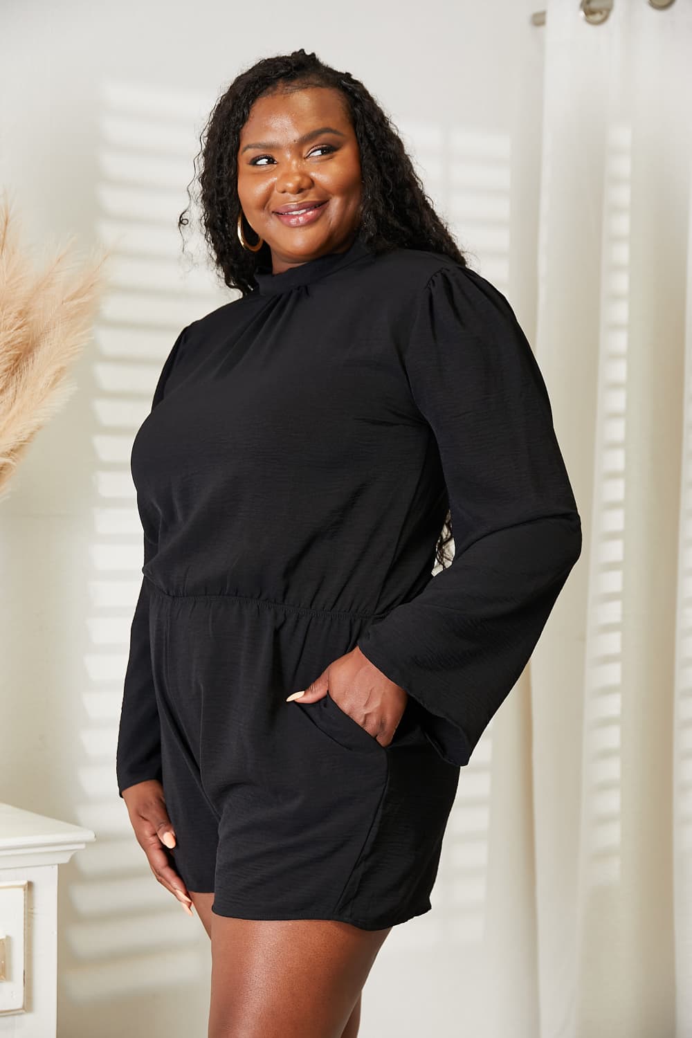 Model showing the pocket detail on the black romper