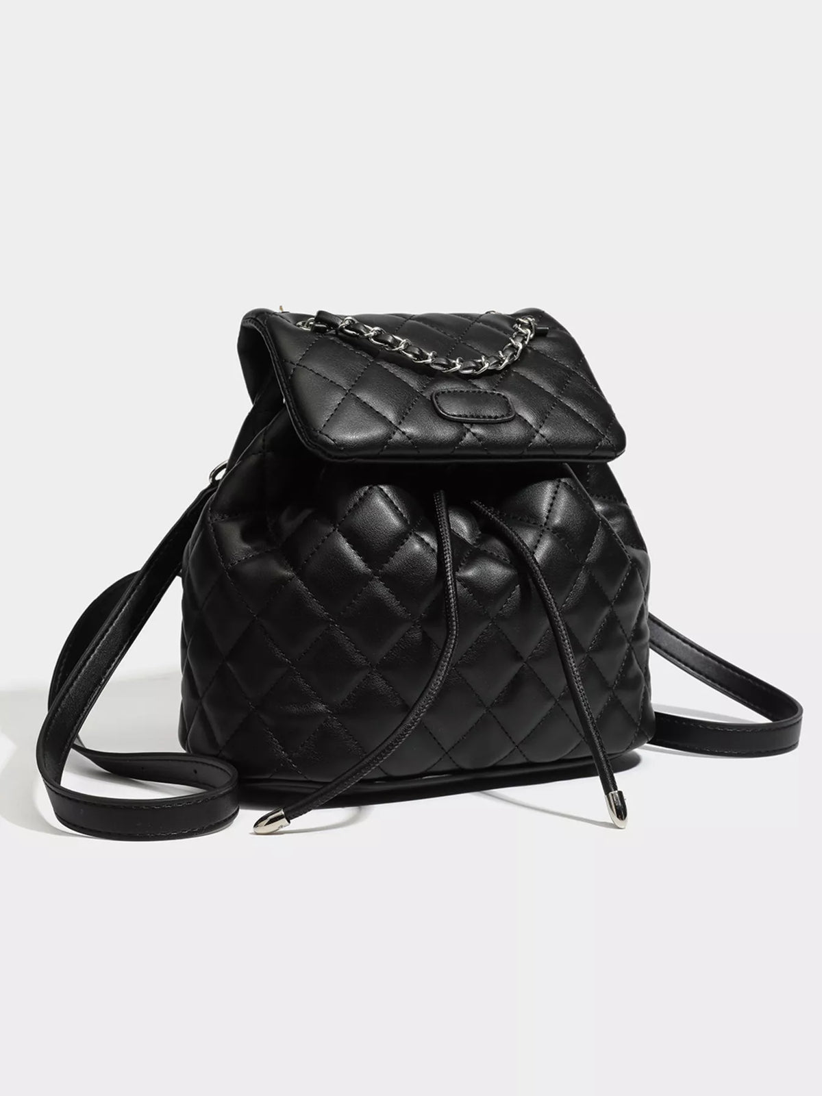 Black quilted chain flap backpack back and straps