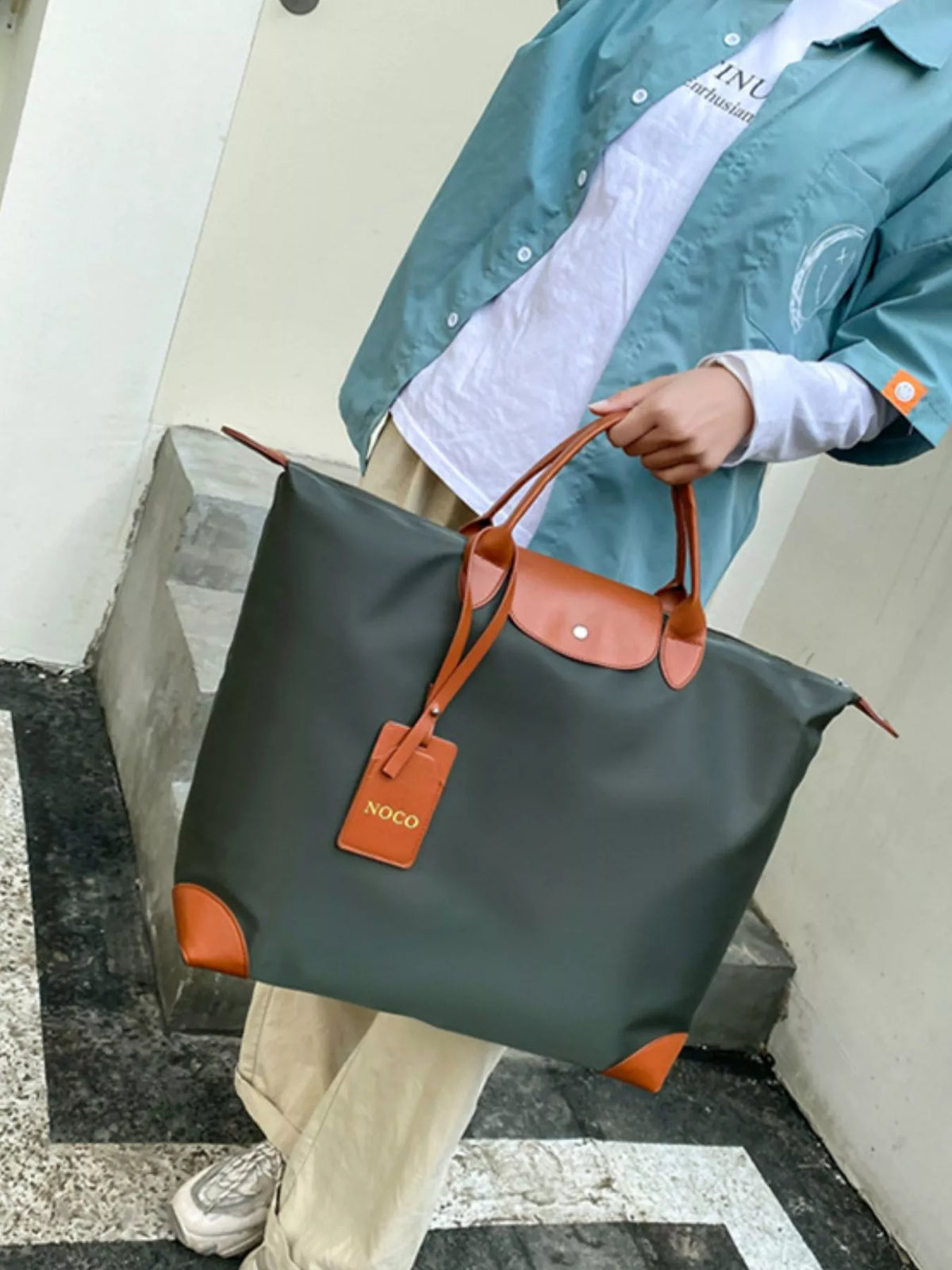 Green lightweight travel duffel side view