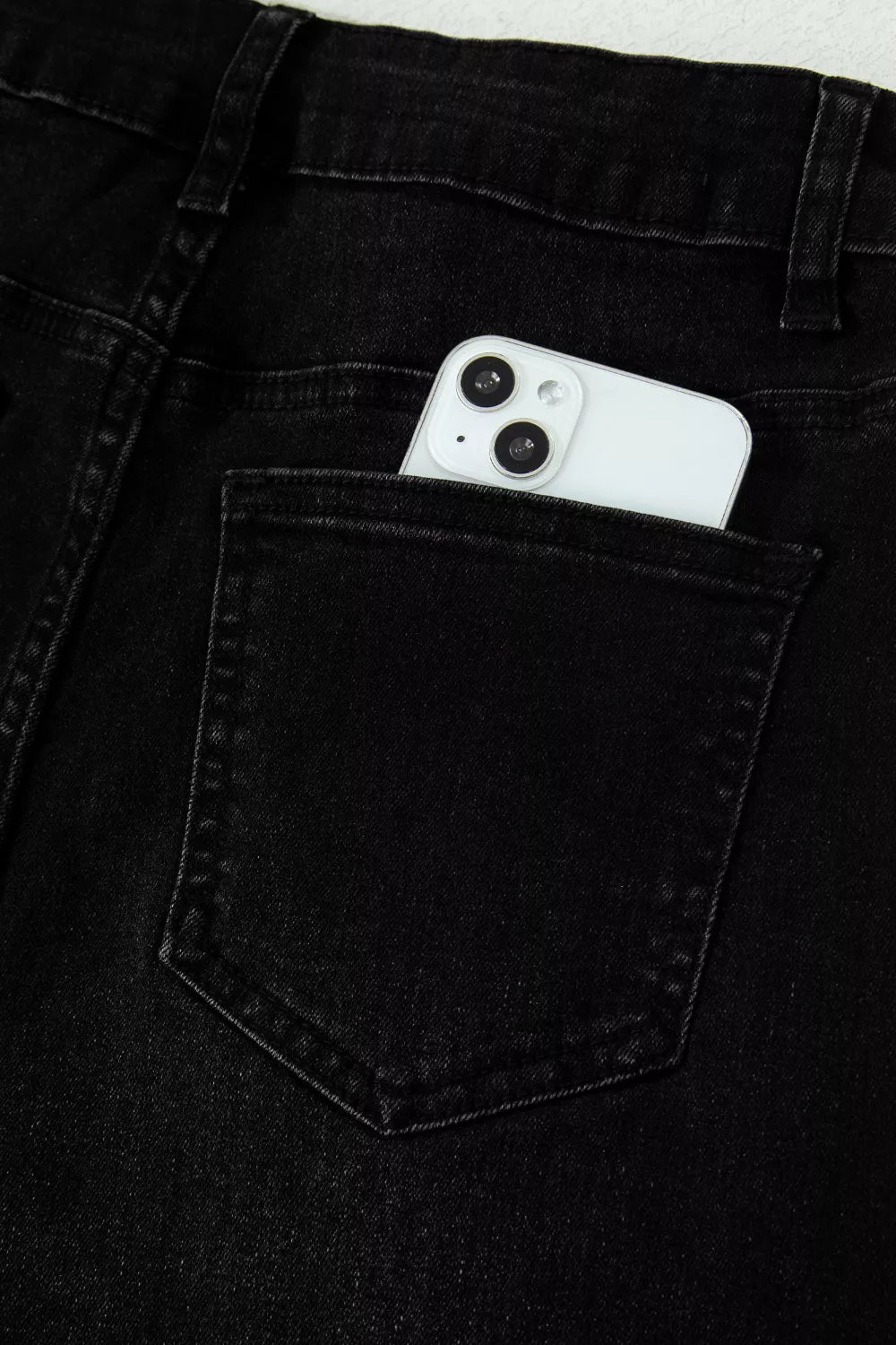 Black straight leg jeans back view with pockets
