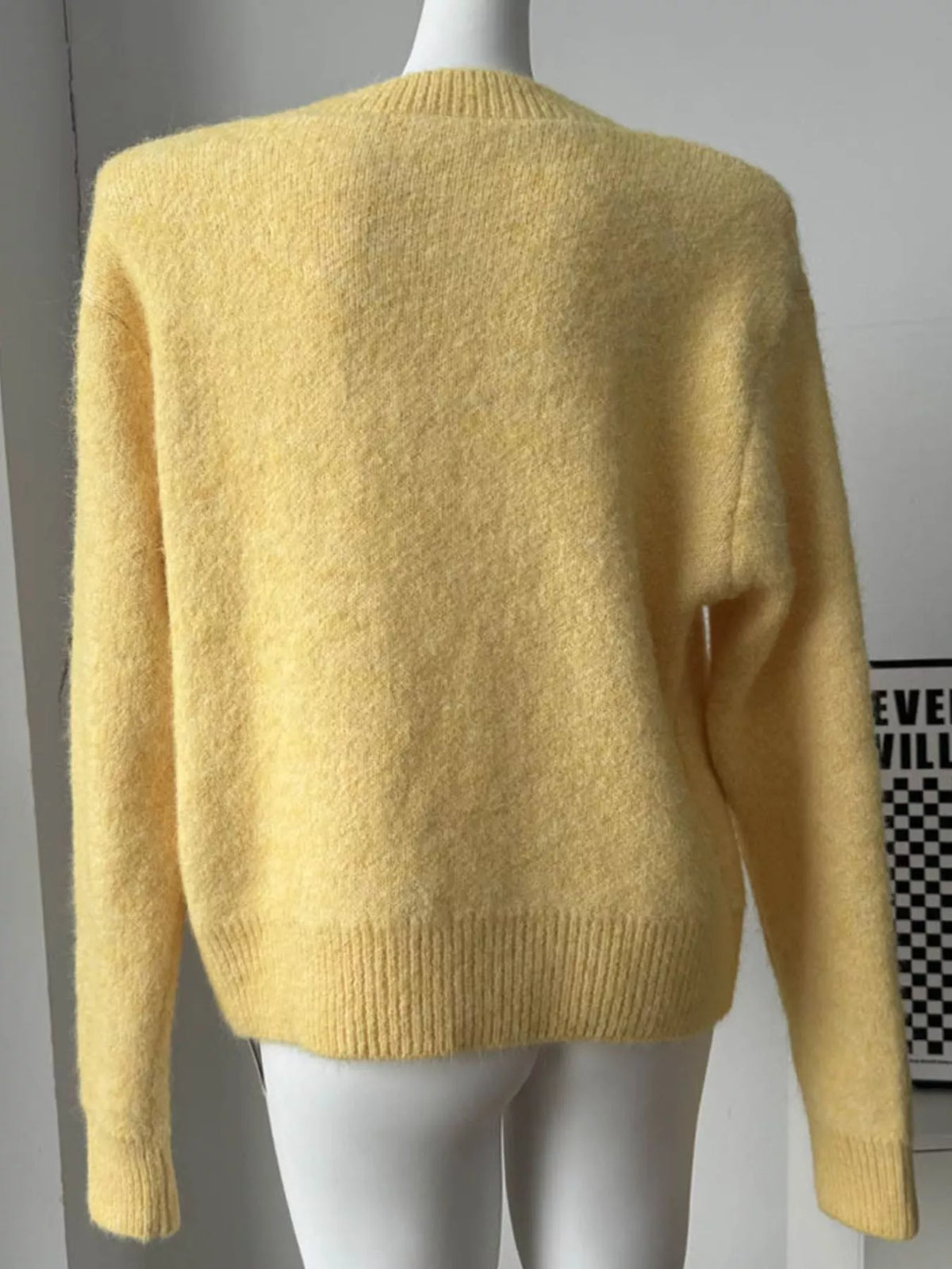 round neck dropped shoulder sweater knit texture close up