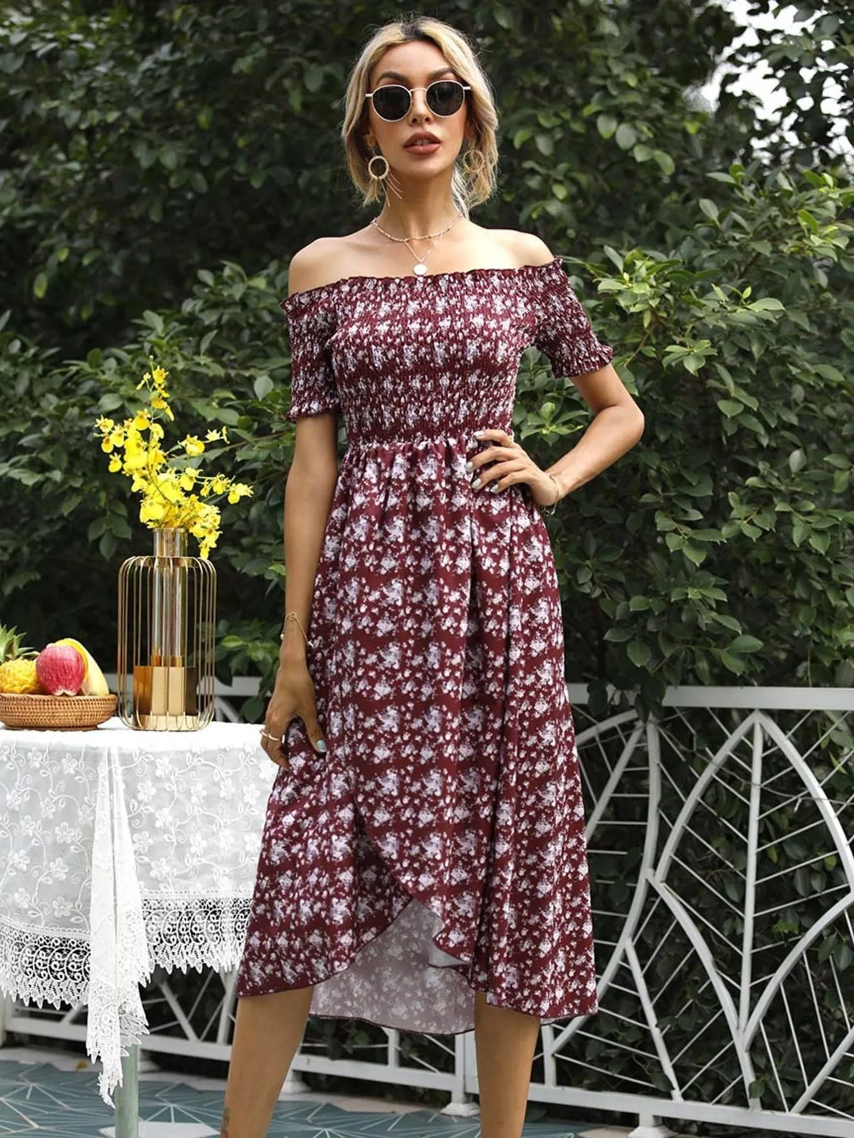Three quarter view of the off shoulder slit dress