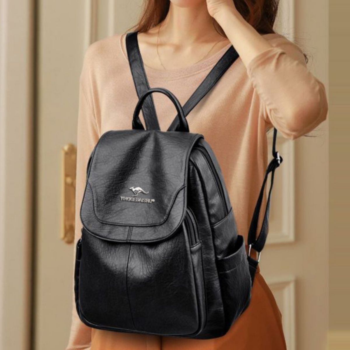 Leather backpack adjustable strap detail