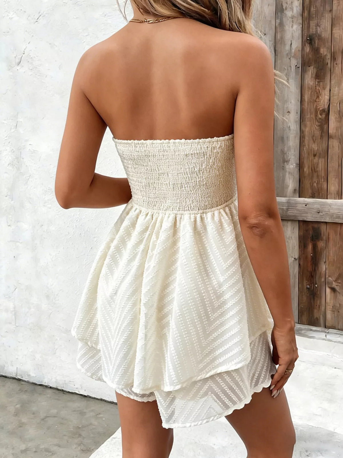 White tube mini dress shown from the side